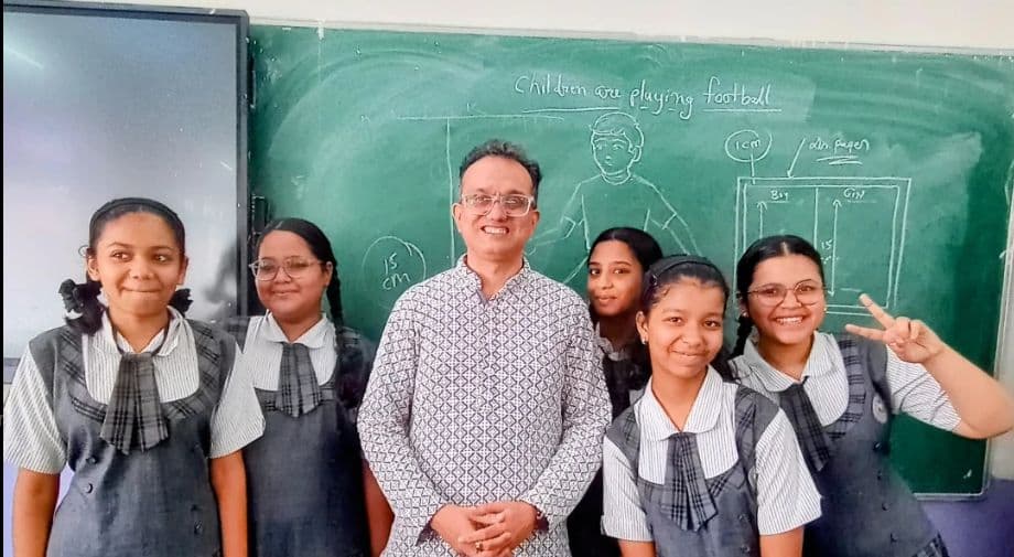 Students standing with the founder